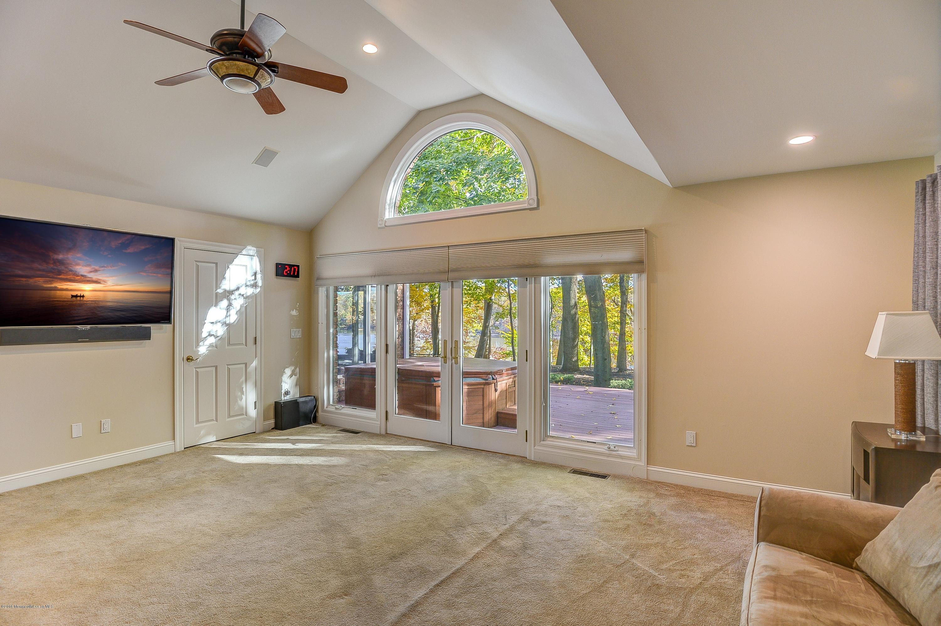 31 Beaver Dam Road Colts Neck, NJ 07722 - Photo 25 of 54 a living room with furniture and a flat screen tv