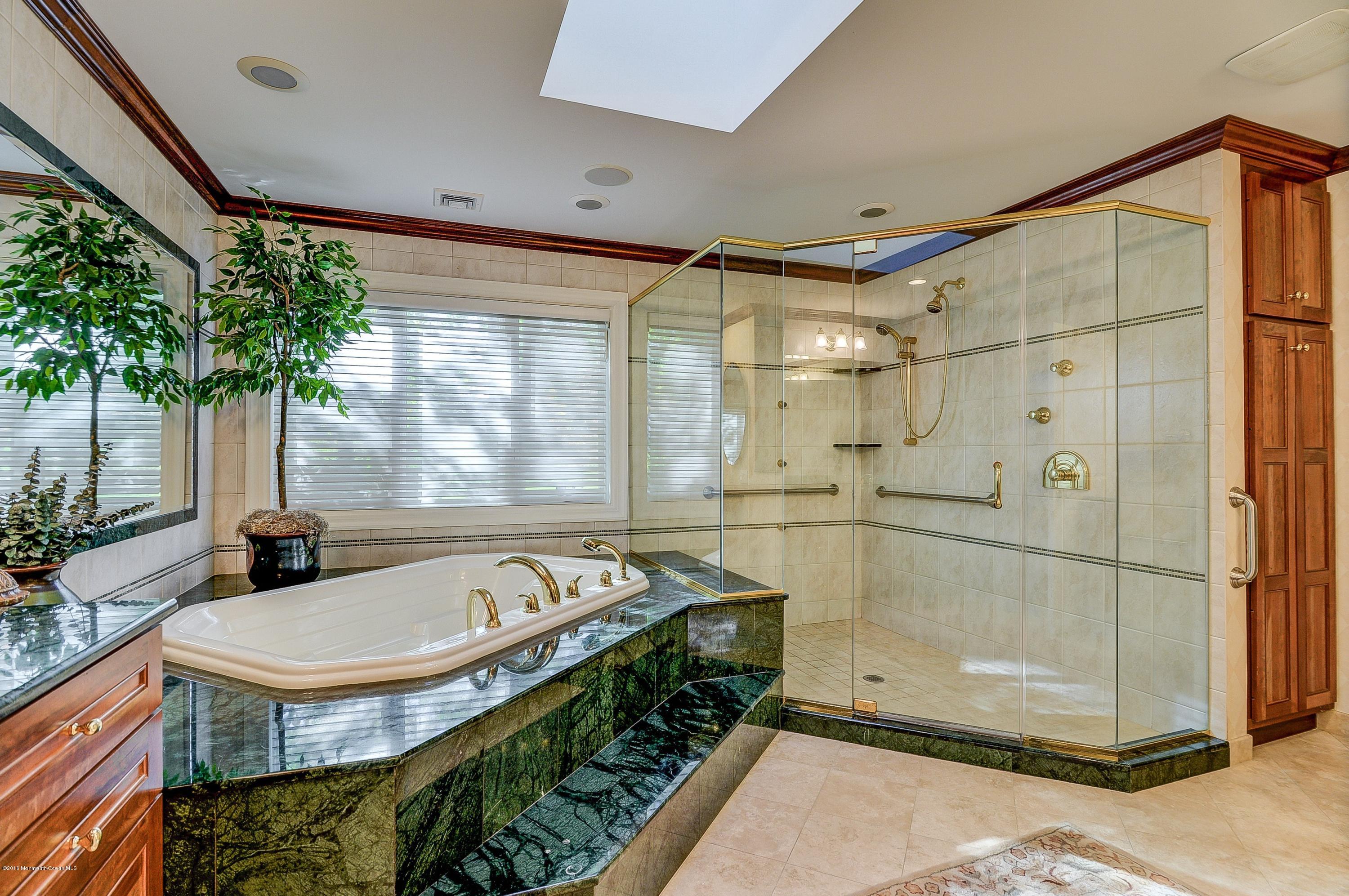 31 Beaver Dam Road Colts Neck, NJ 07722 - Photo 26 of 54 a bathroom with a tub and shower