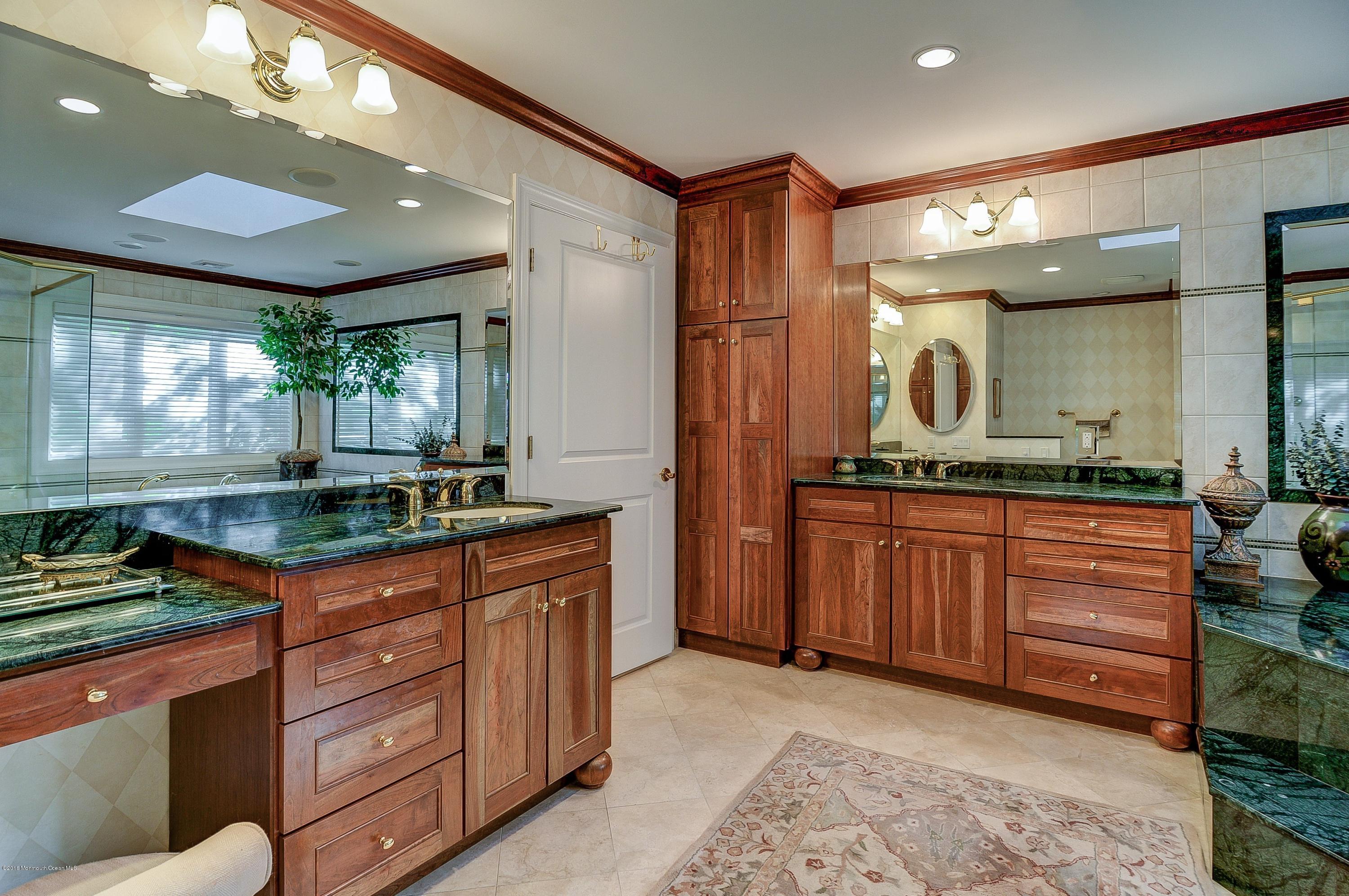 31 Beaver Dam Road Colts Neck, NJ 07722 - Photo 27 of 54 a kitchen with stainless steel appliances granite countertop sink stove and cabinets
