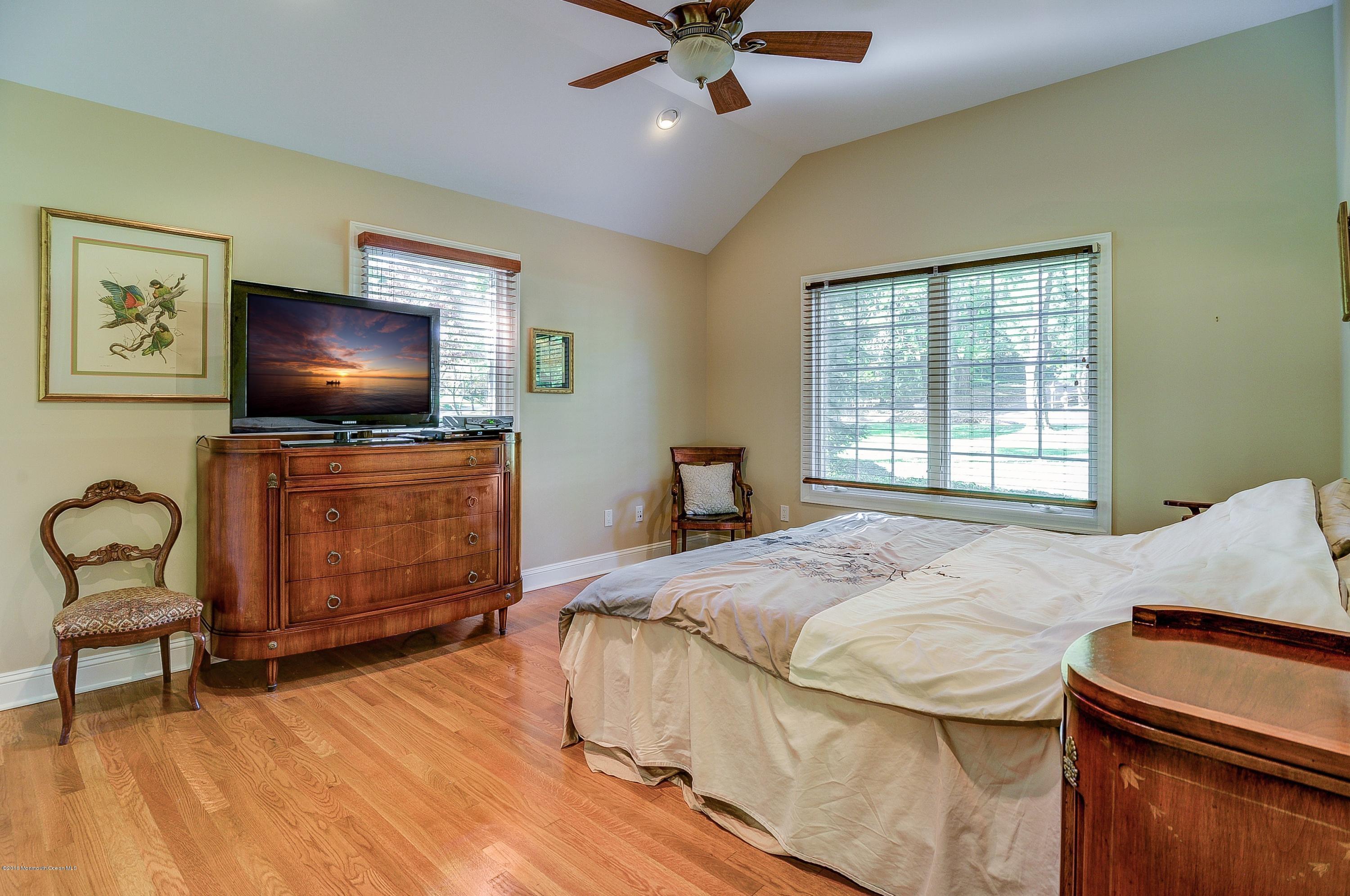 31 Beaver Dam Road Colts Neck, NJ 07722 - Photo 30 of 54 a bedroom with a bed and a flat screen tv
