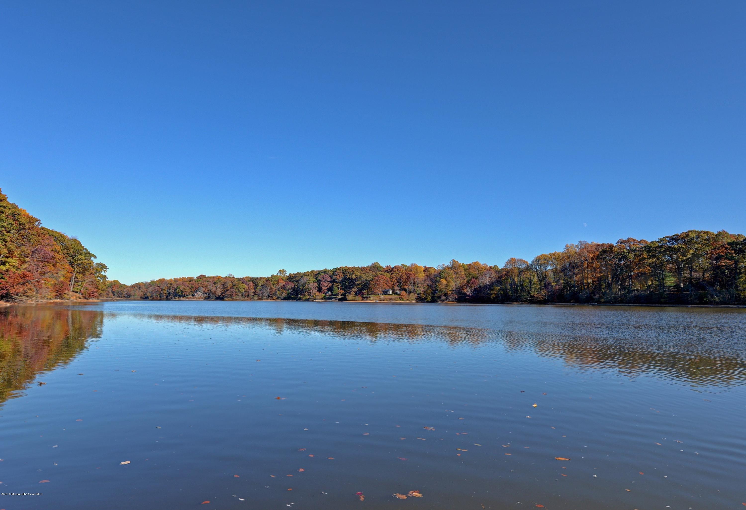 31 Beaver Dam Road Colts Neck, NJ 07722 - Photo 4 of 54 a view of a lake with houses in the back