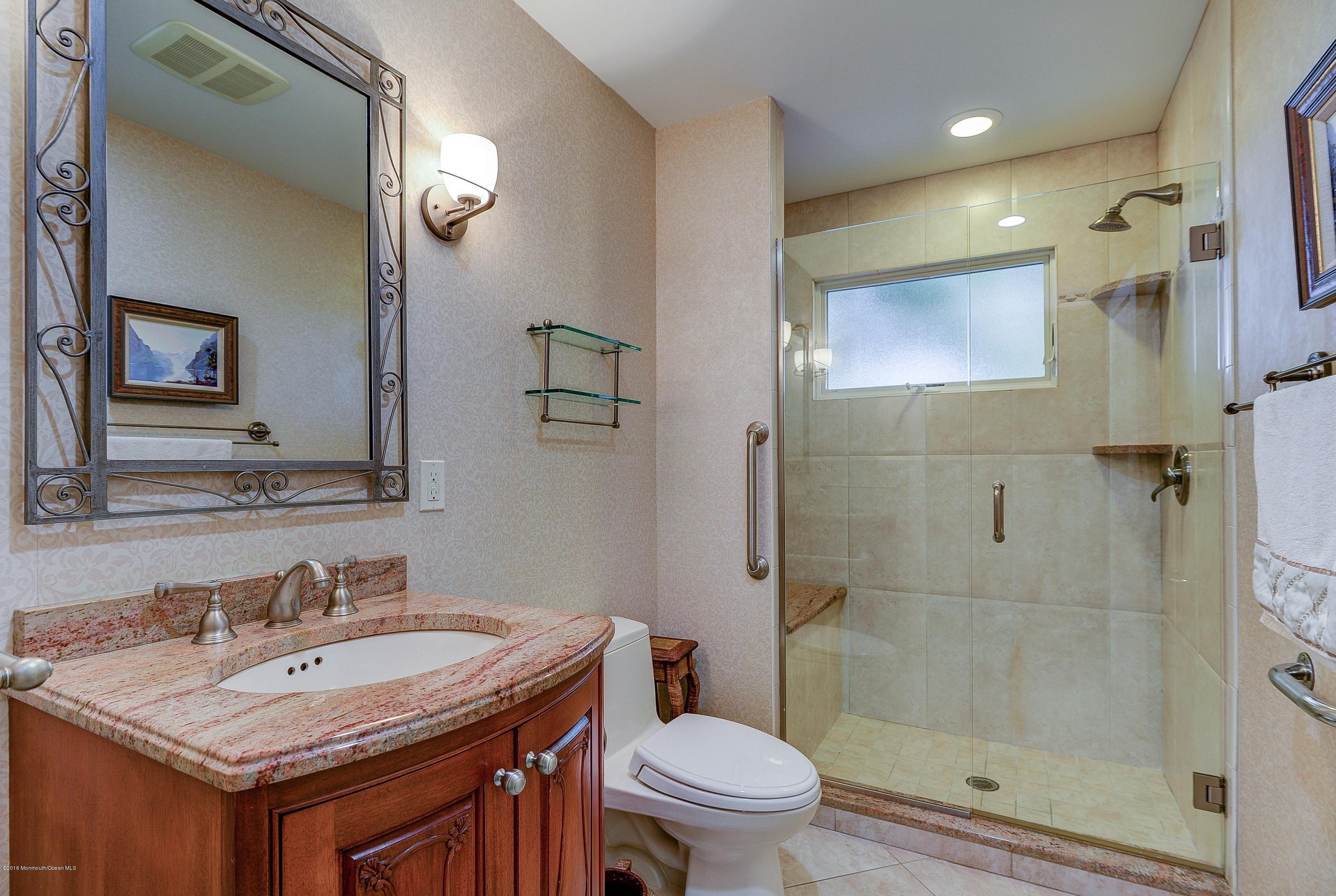 31 Beaver Dam Road Colts Neck, NJ 07722 - Photo 32 of 54 a bathroom with a sink toilet and shower