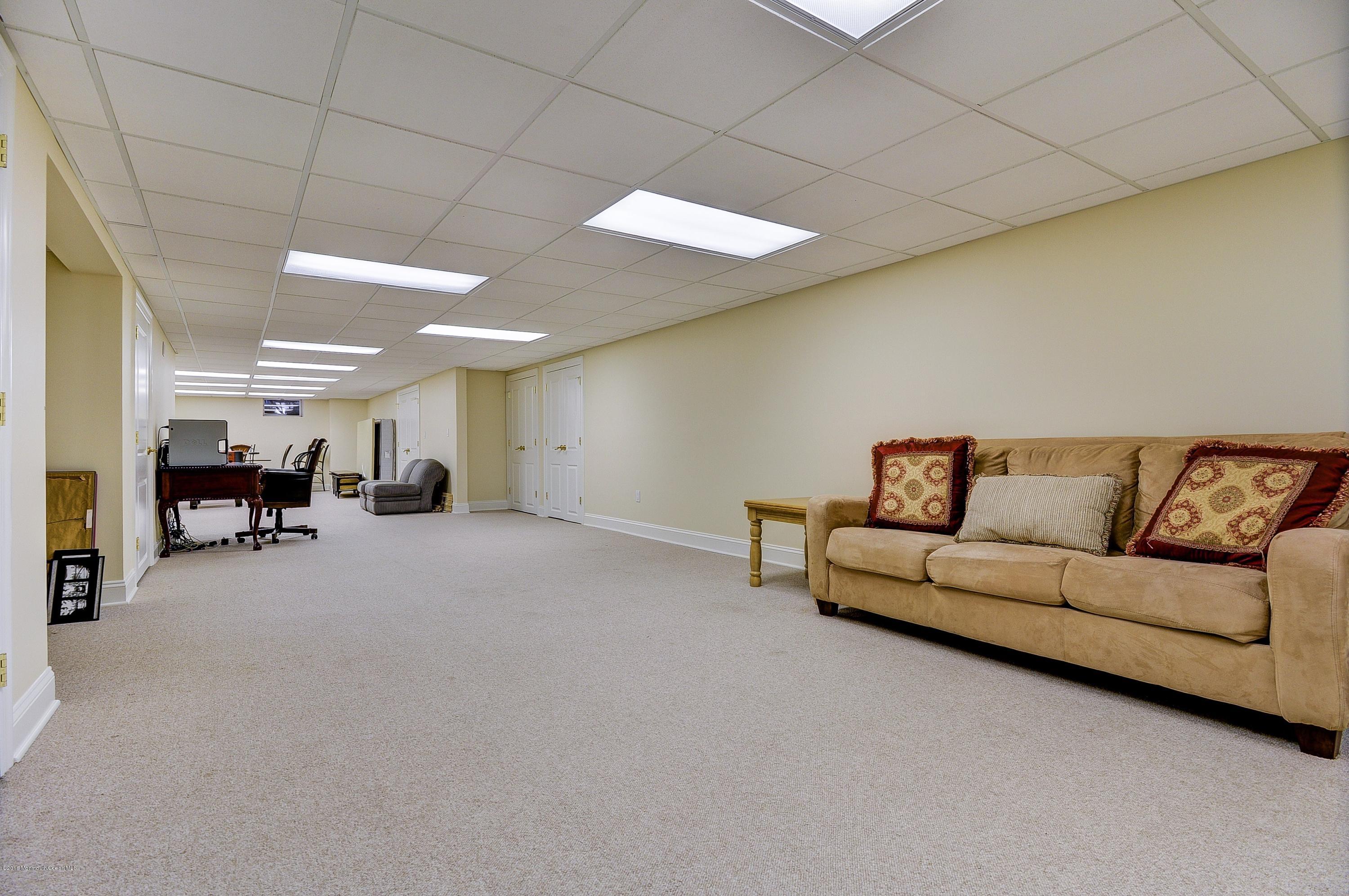 31 Beaver Dam Road Colts Neck, NJ 07722 - Photo 33 of 54 a living room with furniture and a couch