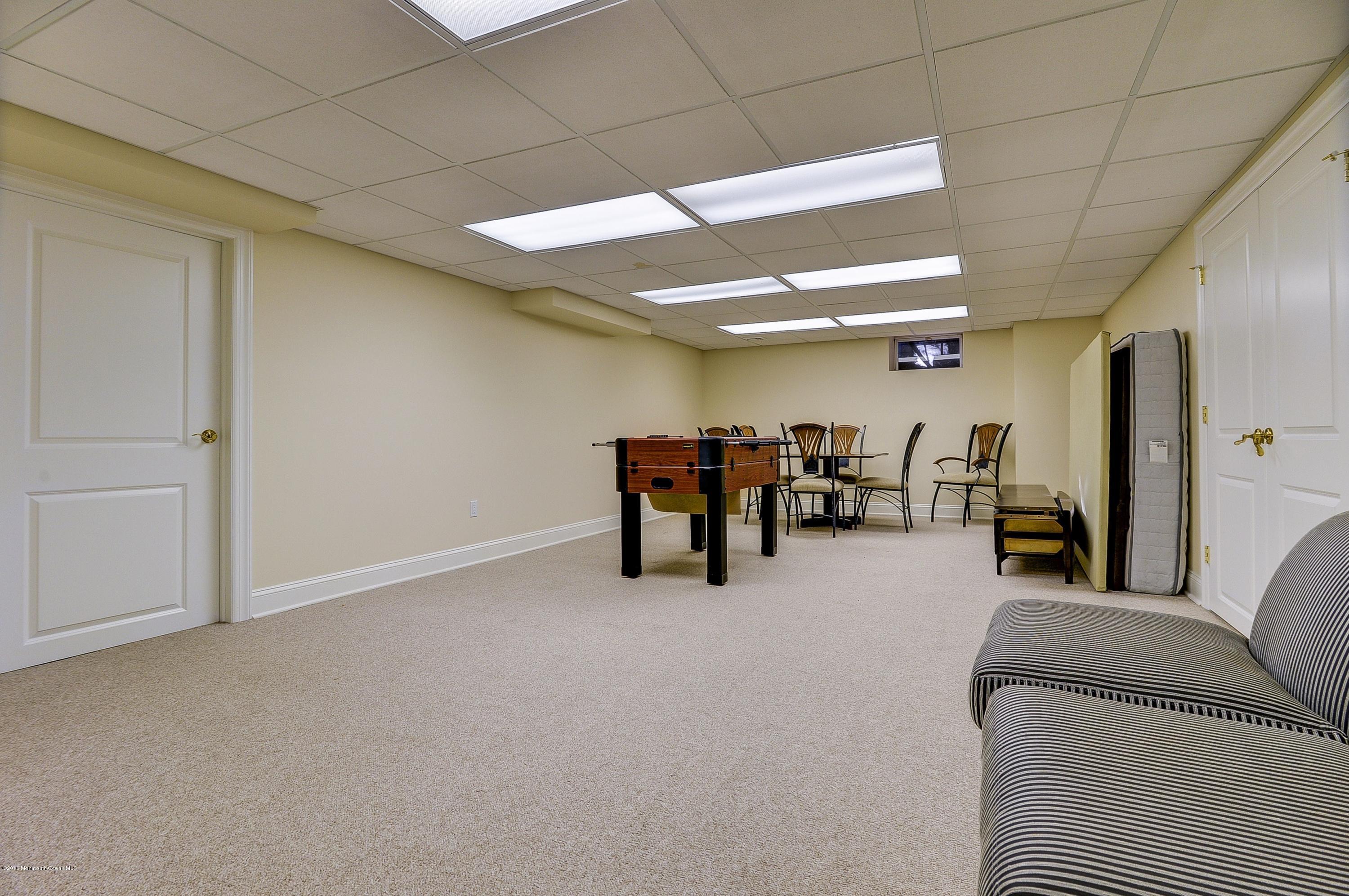 31 Beaver Dam Road Colts Neck, NJ 07722 - Photo 34 of 54 a room with furniture and a ceiling fan