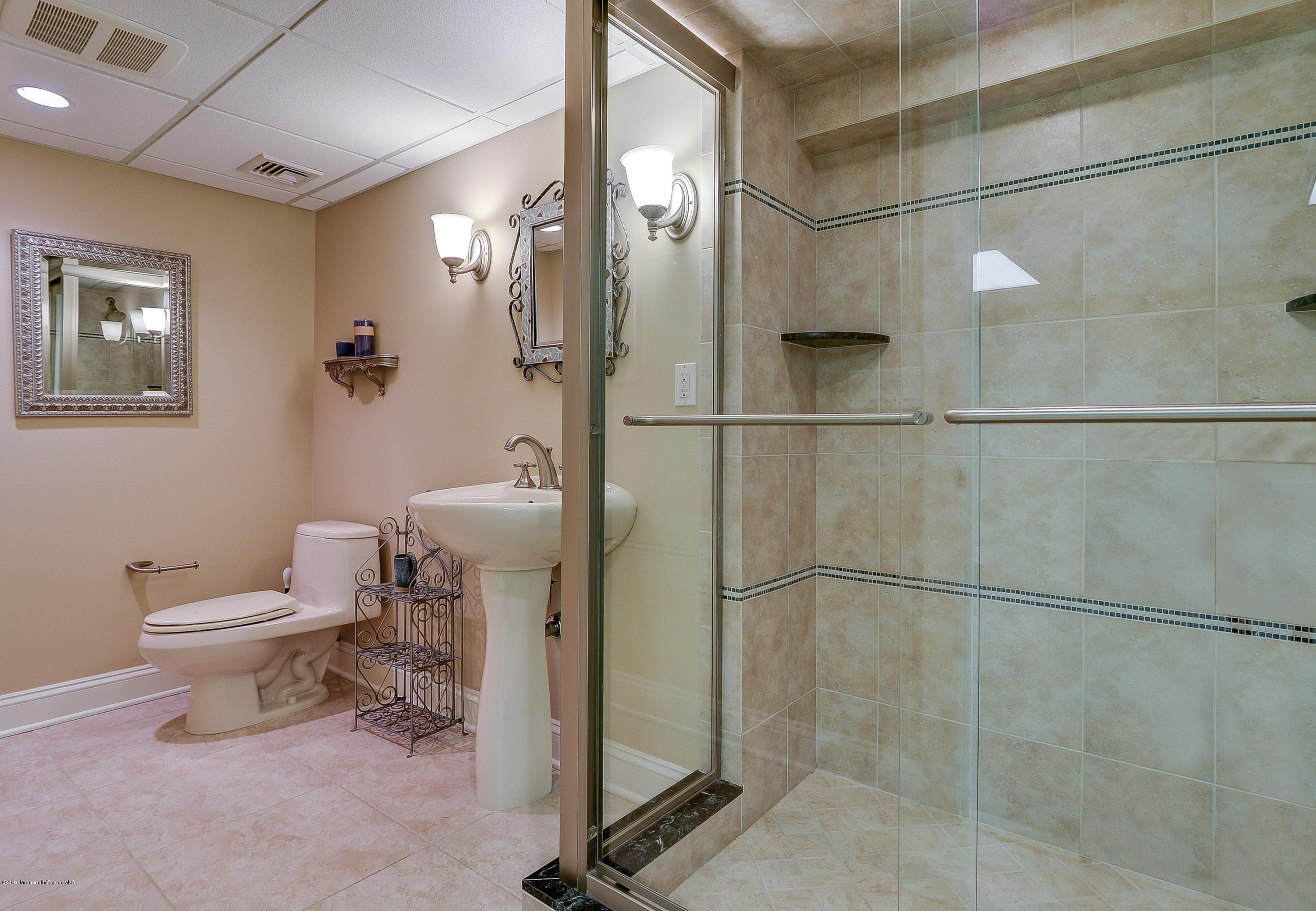 31 Beaver Dam Road Colts Neck, NJ 07722 - Photo 36 of 54 a bathroom with a toilet and a shower