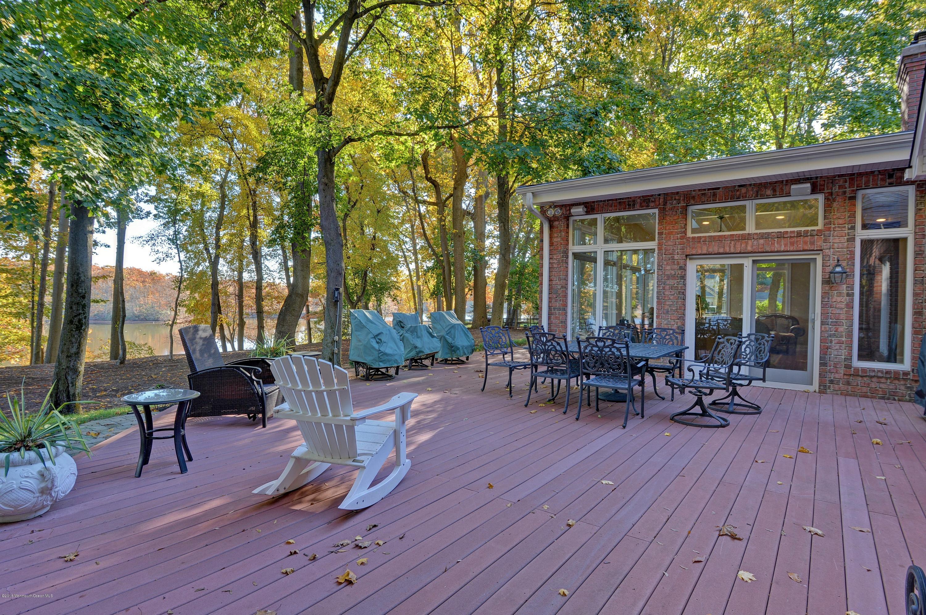 31 Beaver Dam Road Colts Neck, NJ 07722 - Photo 44 of 54 a view of a house with sitting area and garden