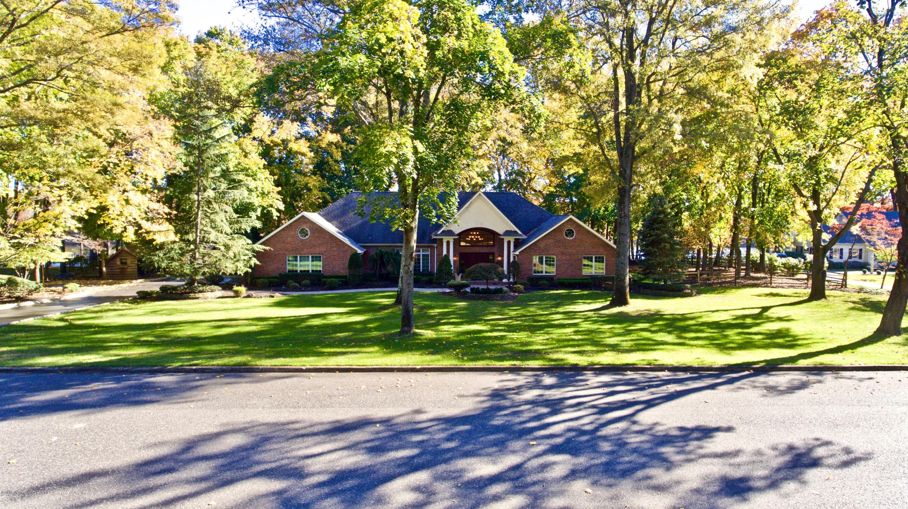 31 Beaver Dam Road Colts Neck, NJ 07722 - Photo 51 of 54 a front view of a house with a yard