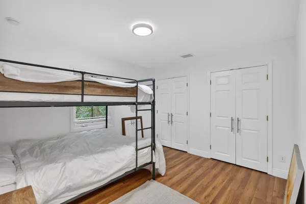 a view of front door with wooden floor