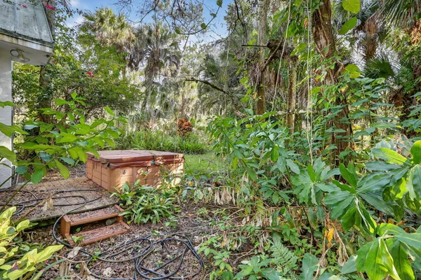a wooden fence with some plants