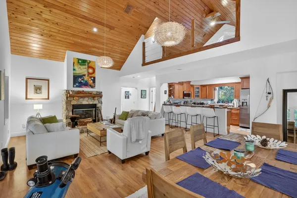 a living room with furniture fireplace and rug