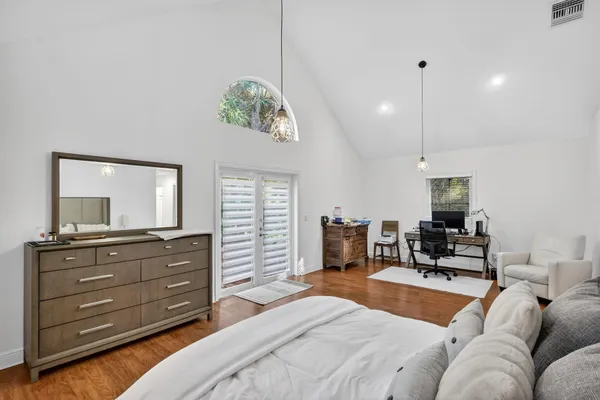 a bedroom with a bed and furniture