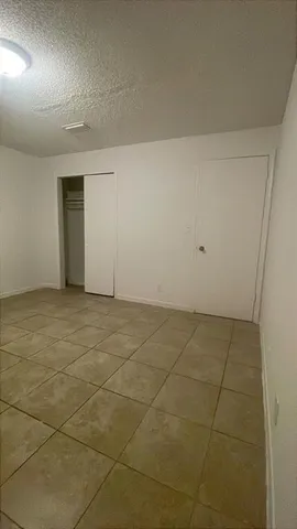 a close view of a utility room with washer and dryer