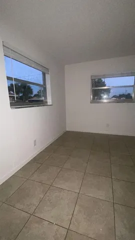 a bathroom with a sink a toilet a shower and a mirror