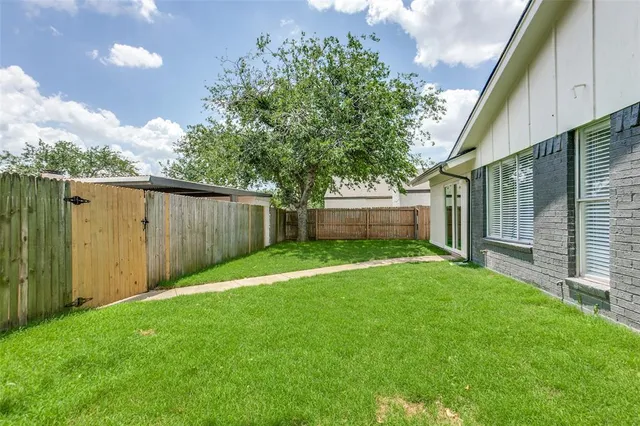 a view of a backyard with a garden