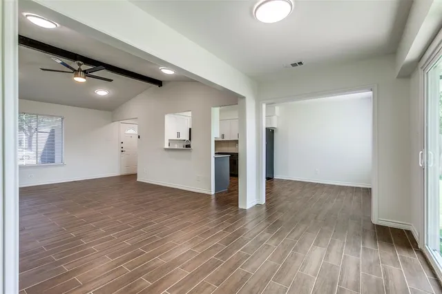 a view of a livingroom with wooden floor