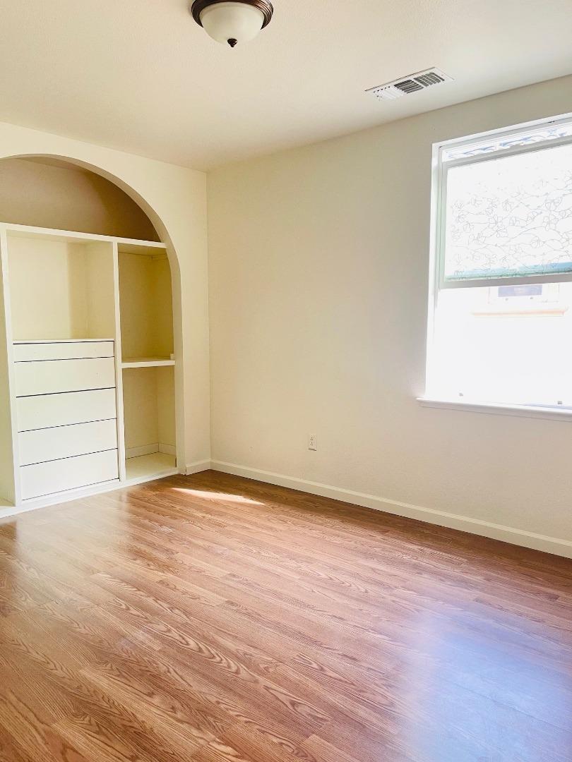 74 Caspian Way Gilroy, CA 95020 - Photo 10 of 18 wooden floor in an empty room with a window