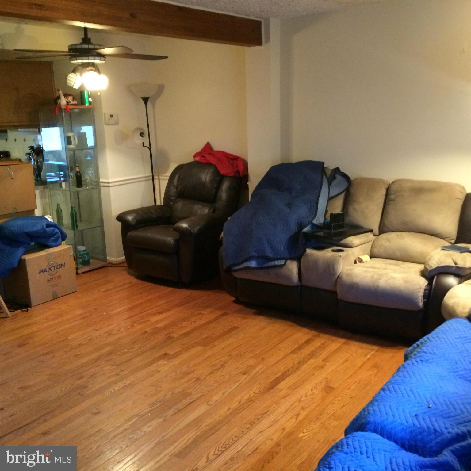 8094 Grandview Court Springfield, VA 22153 - Photo 5 of 13 a living room with furniture and a wooden floor