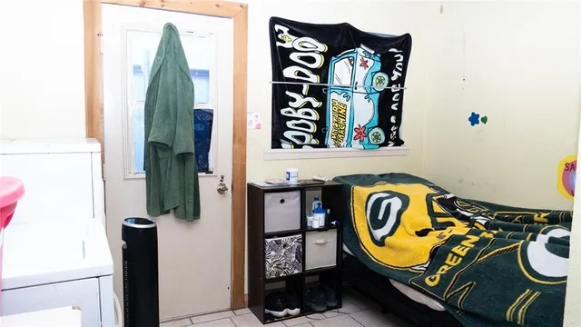 a kitchen with a sink cabinets and a stove top oven