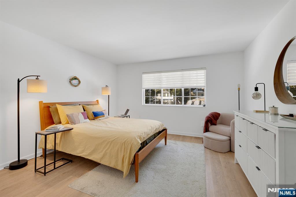 199 Union Avenue, Unit 2F Rutherford, NJ 07070 - Photo 14 of 25 a bedroom with a bed and a window