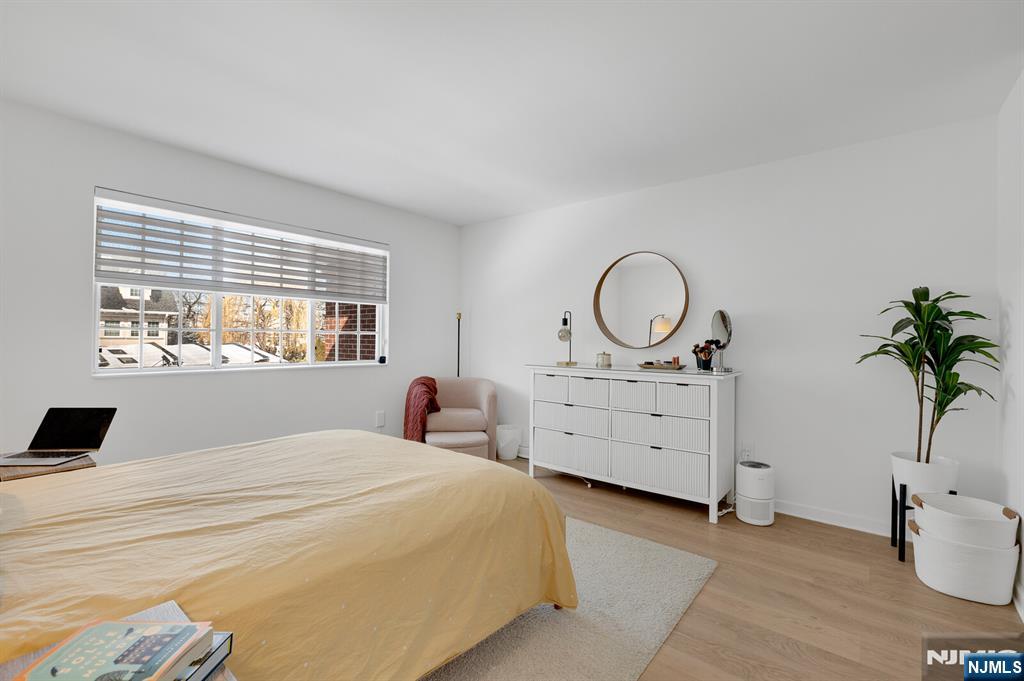 199 Union Avenue, Unit 2F Rutherford, NJ 07070 - Photo 15 of 25 a bedroom with furniture and a window