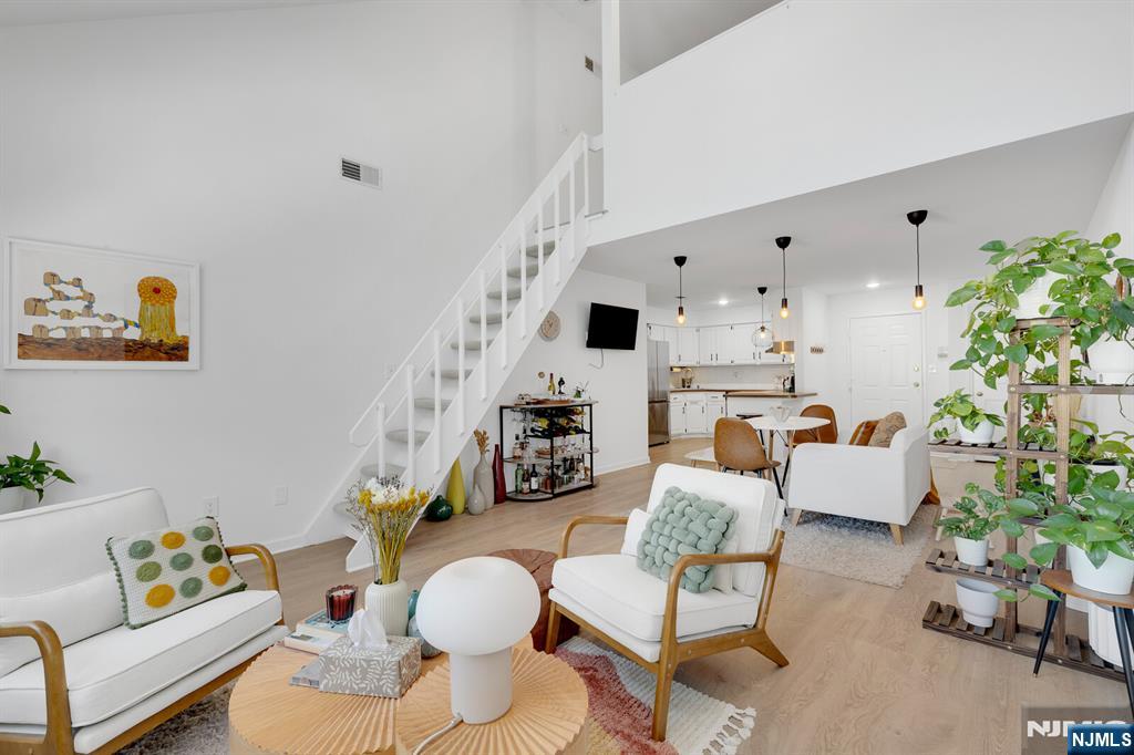 199 Union Avenue, Unit 2F Rutherford, NJ 07070 - Photo 18 of 25 a living room with furniture and a potted plant