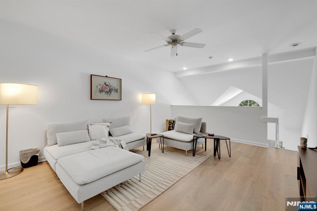 199 Union Avenue, Unit 2F Rutherford, NJ 07070 - Photo 19 of 25 a living room with furniture and wooden floor