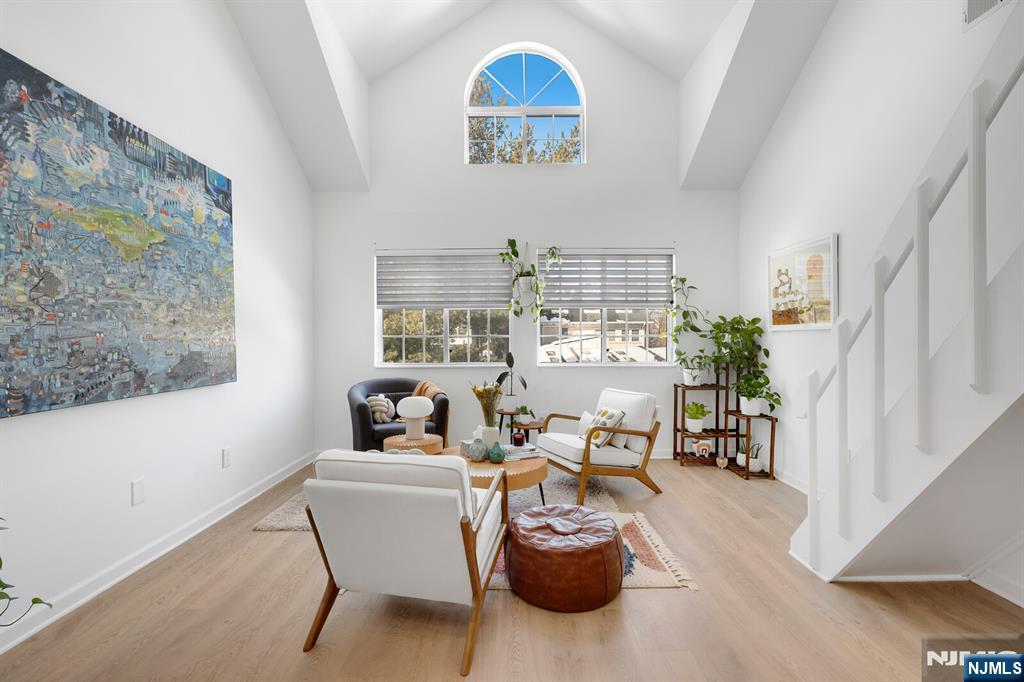 199 Union Avenue, Unit 2F Rutherford, NJ 07070 - Photo 3 of 25 a living room with furniture and a chandelier