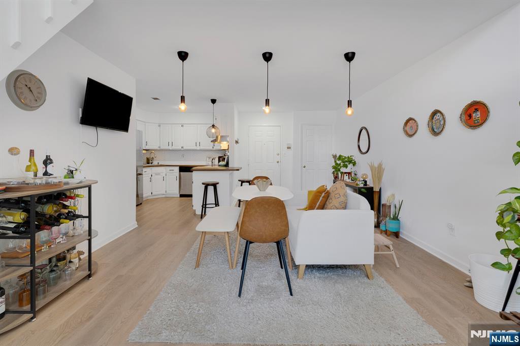 199 Union Avenue, Unit 2F Rutherford, NJ 07070 - Photo 5 of 25 a living room with furniture and a flat screen tv