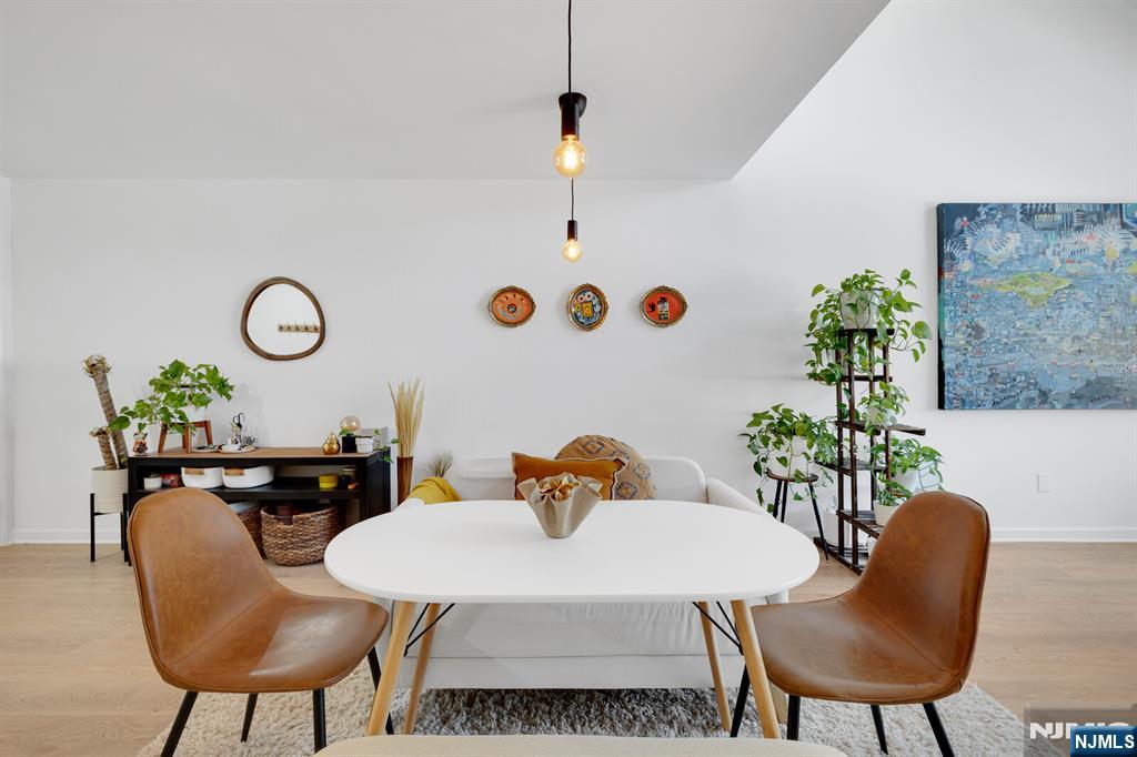 199 Union Avenue, Unit 2F Rutherford, NJ 07070 - Photo 8 of 25 a view of a dining room with furniture and wooden floor