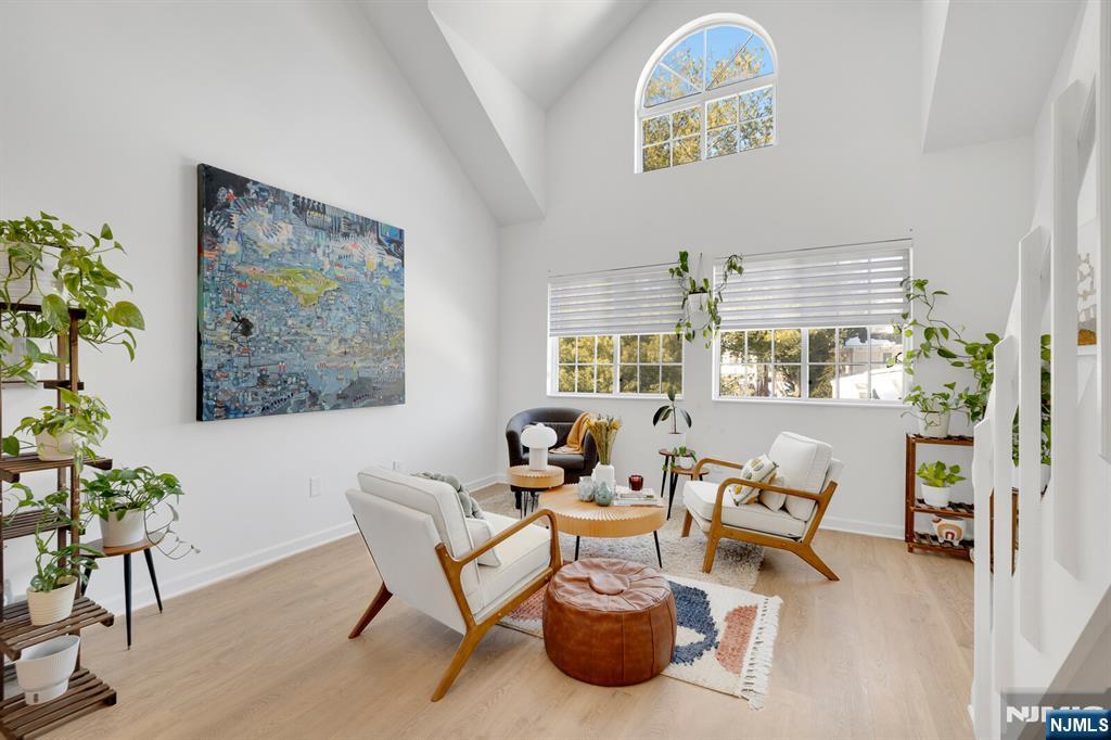 199 Union Avenue, Unit 2F Rutherford, NJ 07070 - Photo 9 of 25 a living room with furniture and a large window