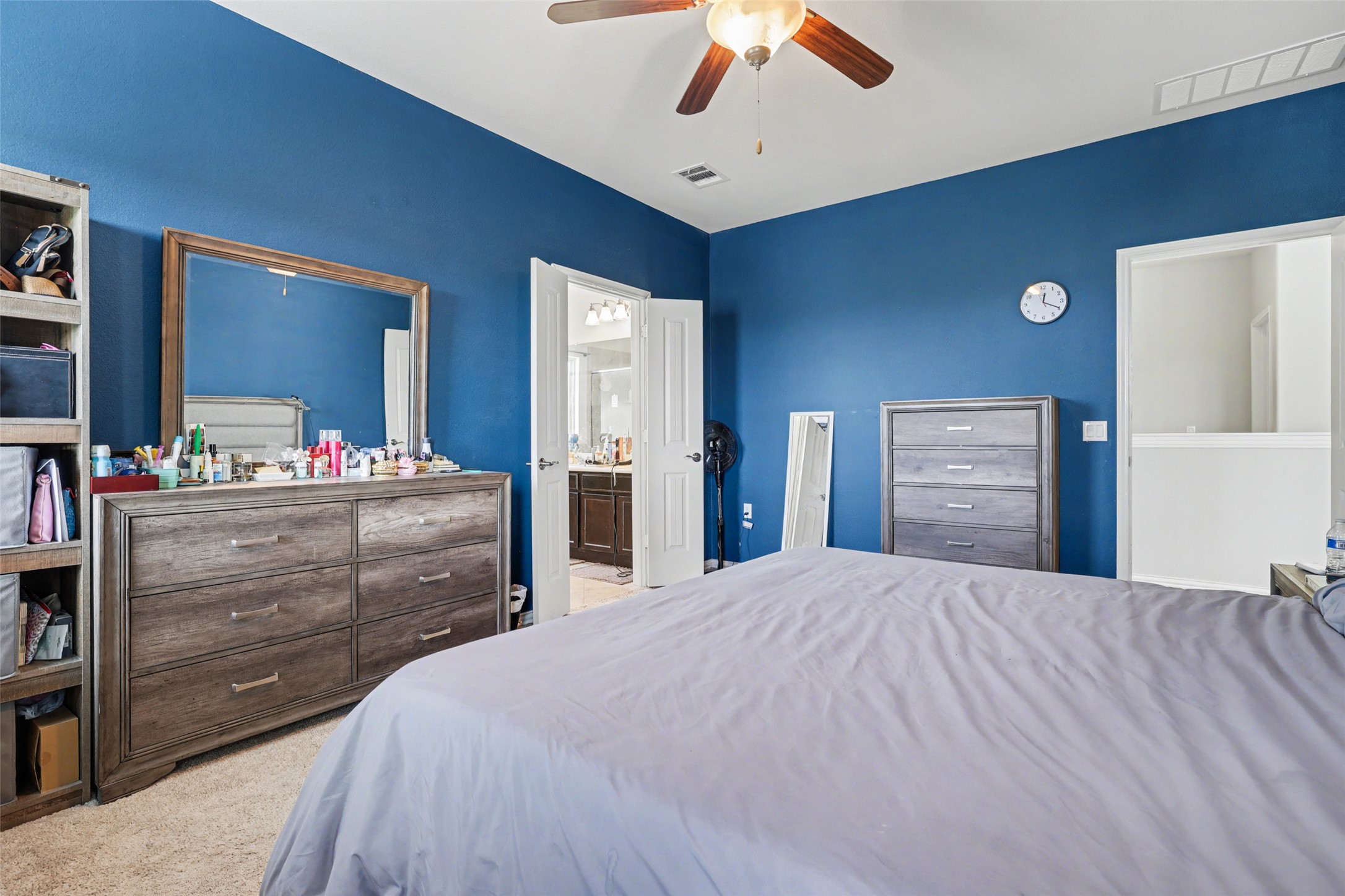 5845 Kleberg Trail Austin, TX 78747 - Photo 13 of 30 a bedroom with a large bed and a dresser