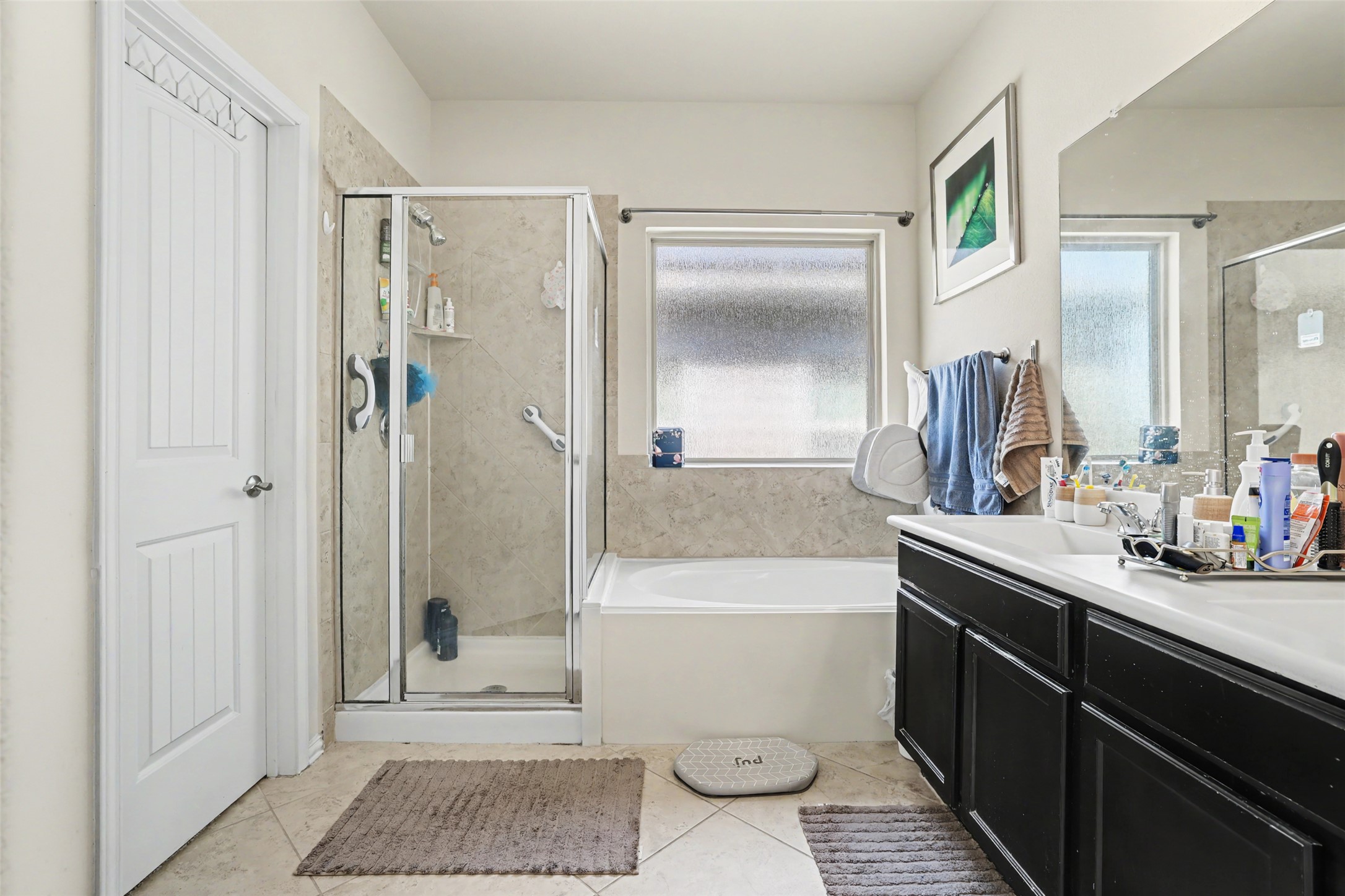 5845 Kleberg Trail Austin, TX 78747 - Photo 14 of 30 a bathroom with a sink a toilet and shower