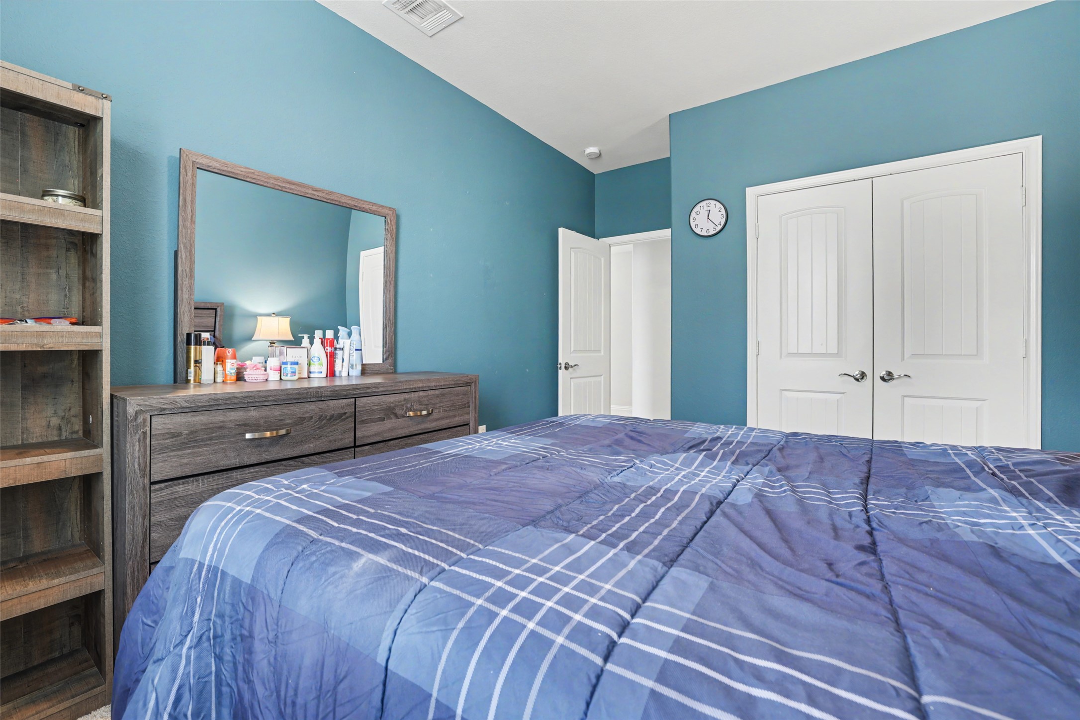 5845 Kleberg Trail Austin, TX 78747 - Photo 16 of 30 a bedroom with a large bed and a dresser