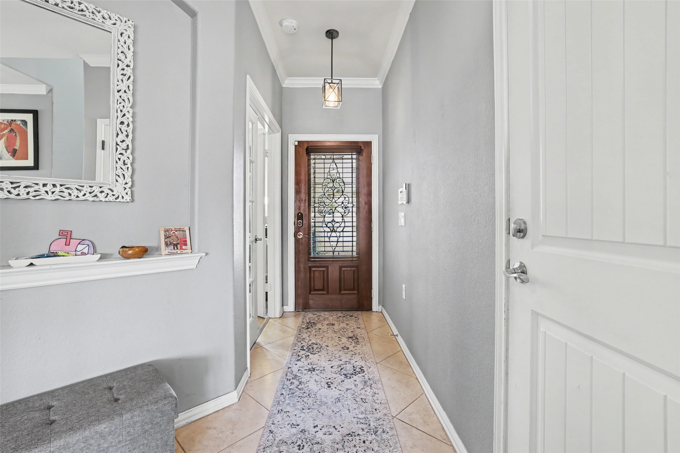 5845 Kleberg Trail Austin, TX 78747 - Photo 2 of 30 a hallway with dining table and chairs