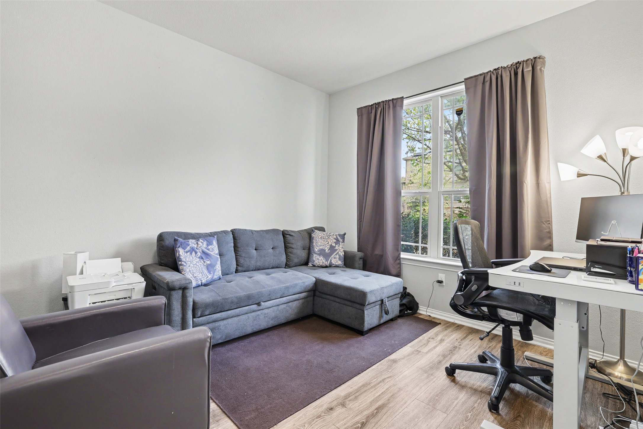 5845 Kleberg Trail Austin, TX 78747 - Photo 22 of 30 a living room with furniture and a window
