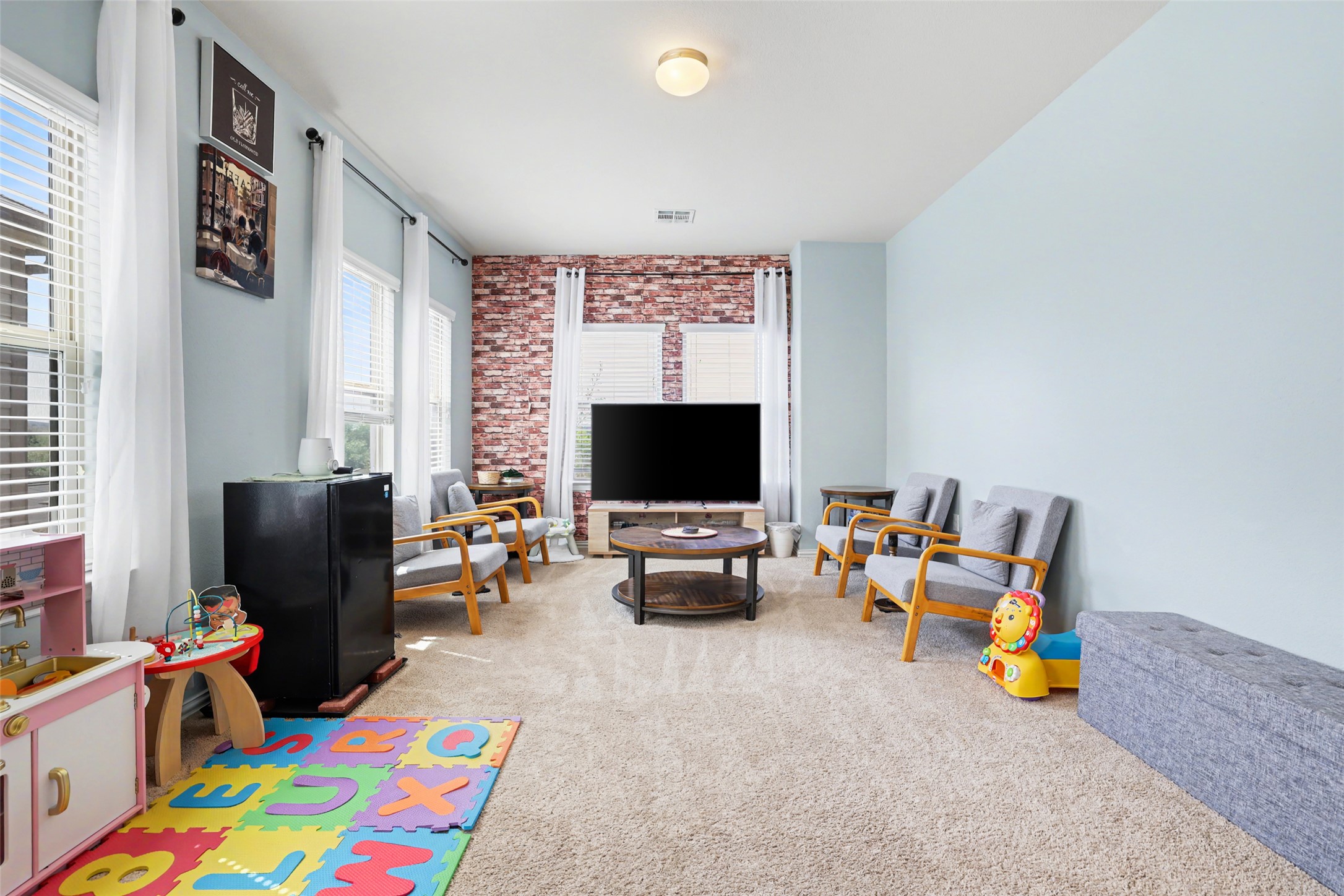 5845 Kleberg Trail Austin, TX 78747 - Photo 24 of 30 a children room with furniture and a flat screen tv