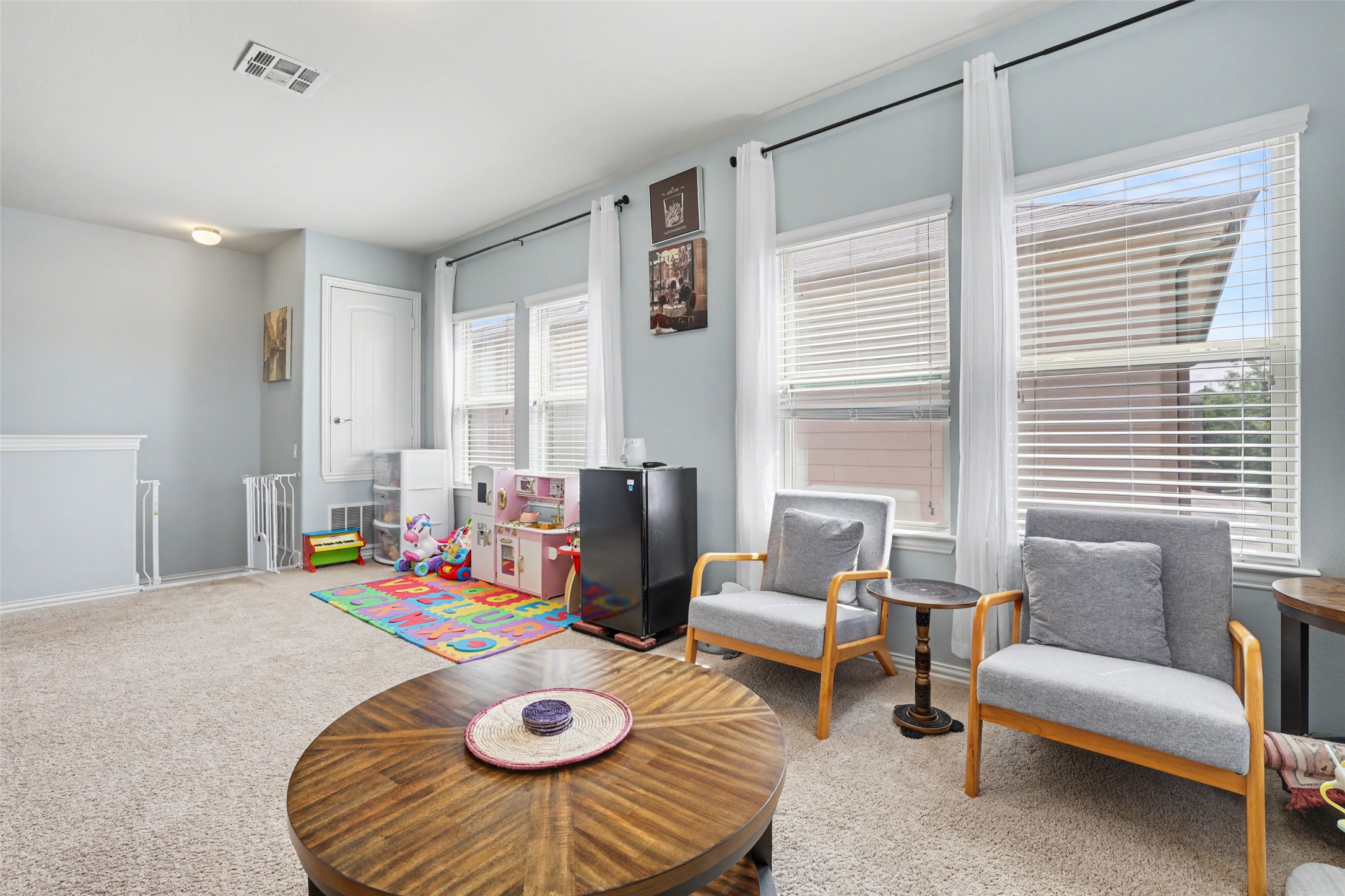 5845 Kleberg Trail Austin, TX 78747 - Photo 25 of 30 a living room with furniture and a table