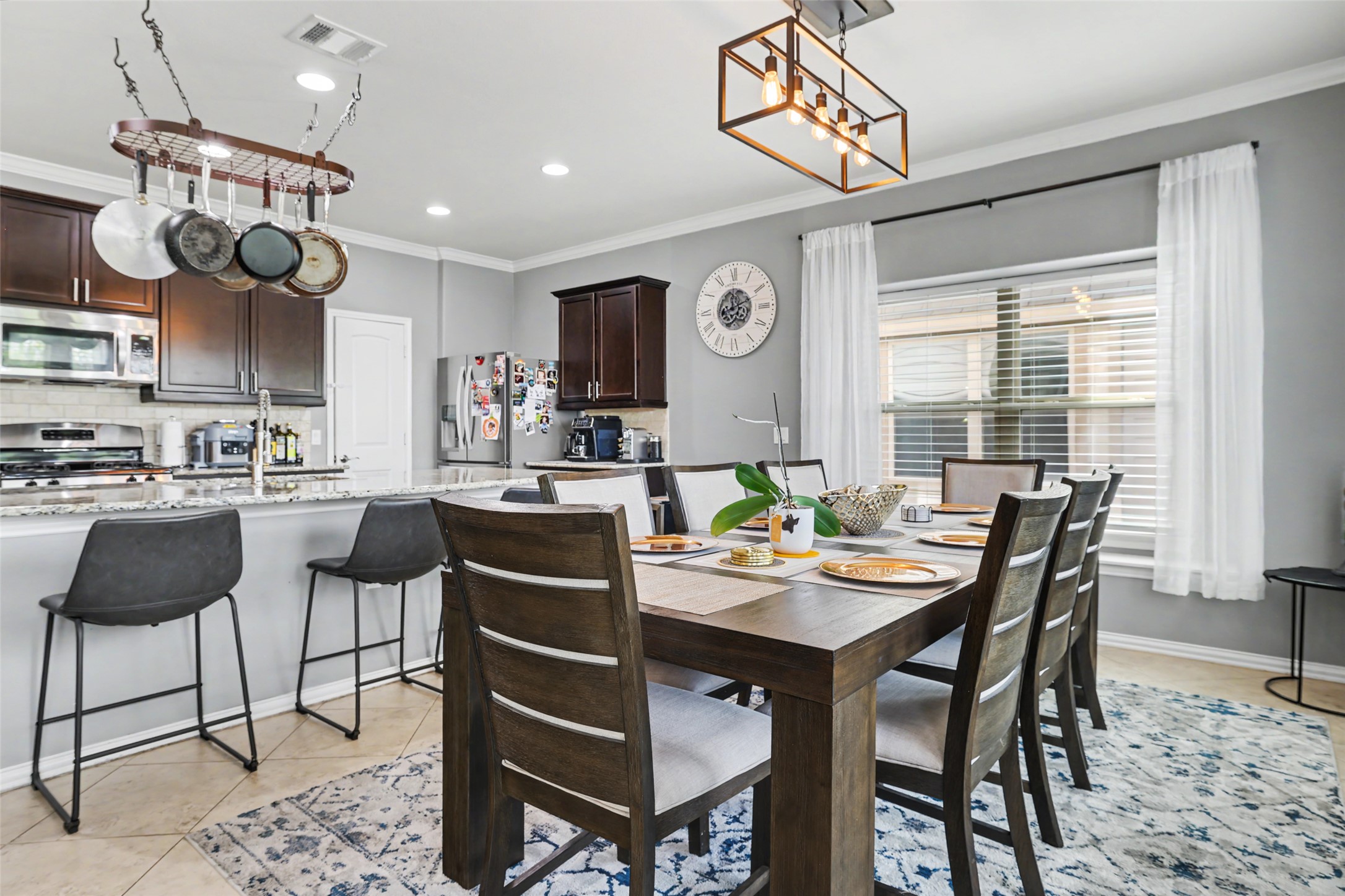 5845 Kleberg Trail Austin, TX 78747 - Photo 9 of 30 a kitchen with a dining table and chairs