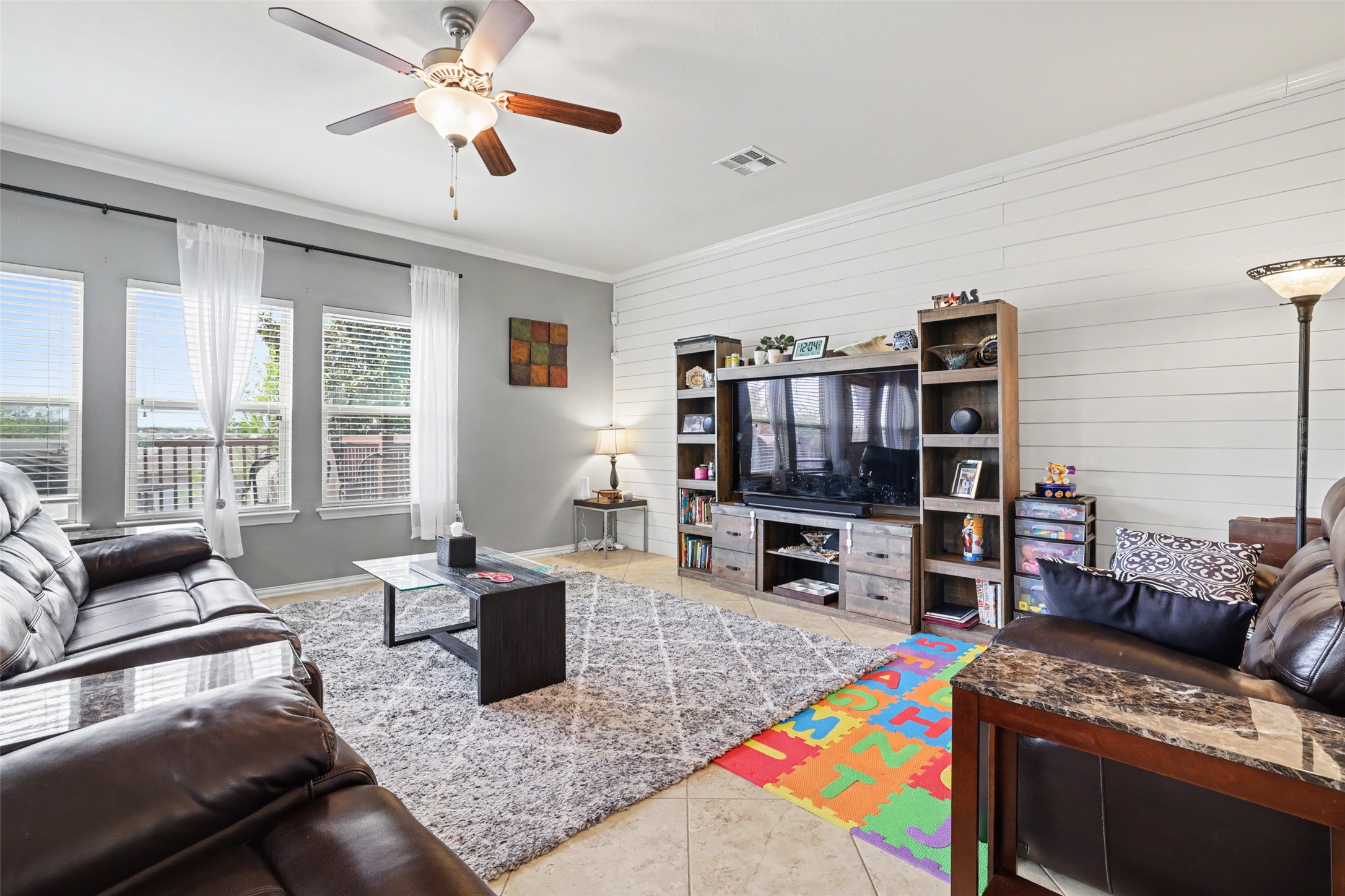 5845 Kleberg Trail Austin, TX 78747 - Photo 10 of 30 a living room with furniture and a flat screen tv