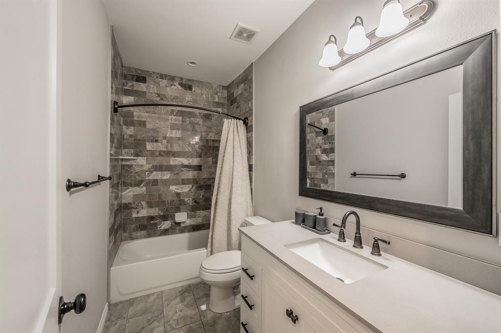 405 Dallas Street Rice, TX 75155 - Photo 28 of 40 a bathroom with a sink toilet and shower