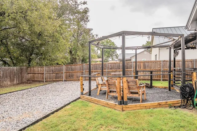 a view of a backyard with a patio