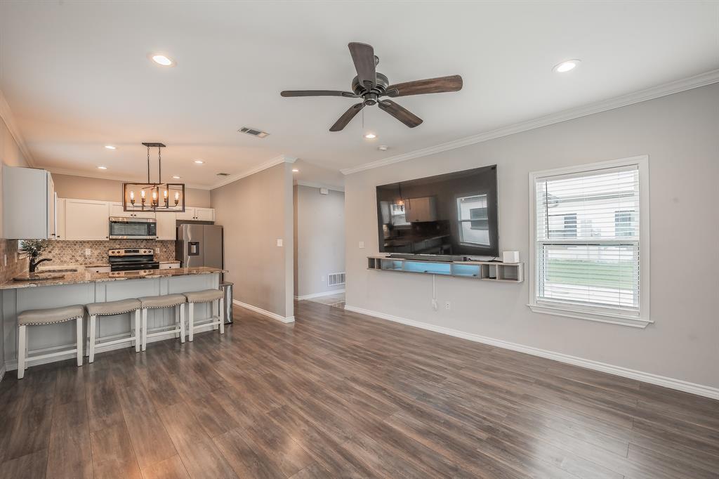 405 Dallas Street Rice, TX 75155 - Photo 6 of 40 a living room with stainless steel appliances furniture and a flat screen tv