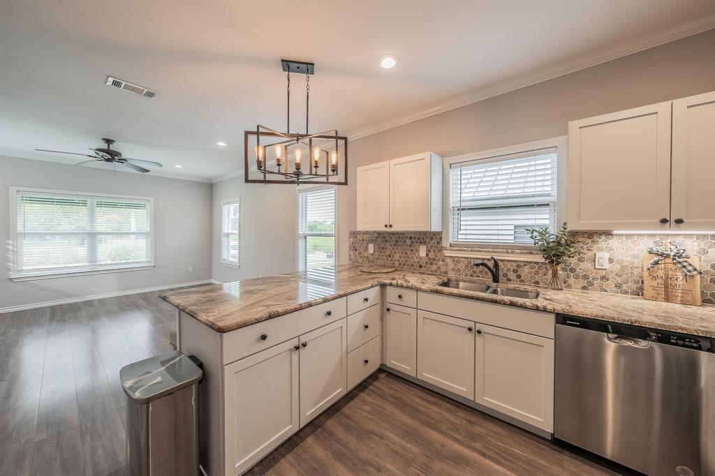405 Dallas Street Rice, TX 75155 - Photo 9 of 40 a kitchen with a sink stove and window