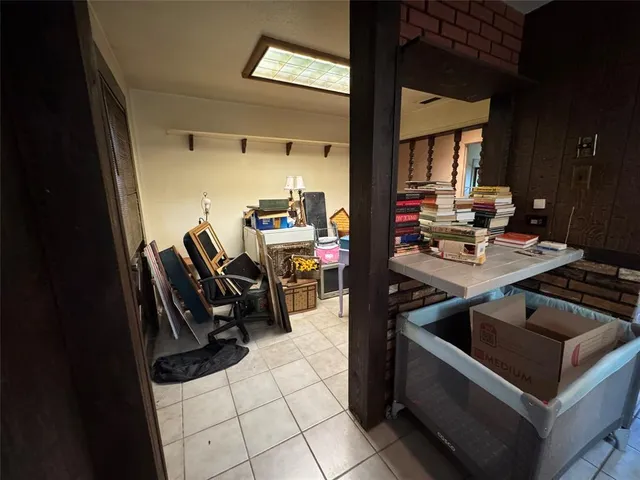 a view of room with stairs and wooden floor