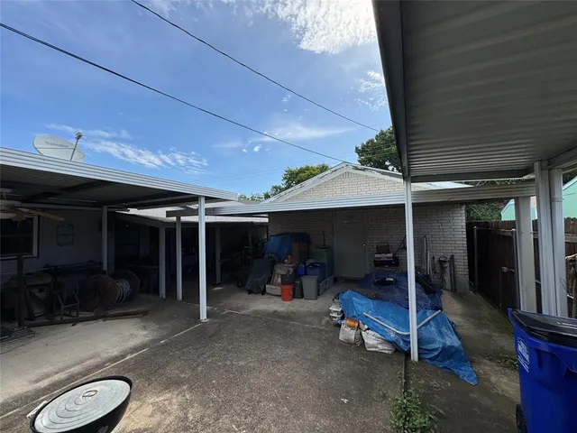a sign board with a play ground in the back