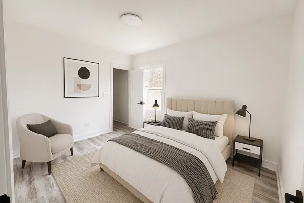a bedroom with a bed and a couch