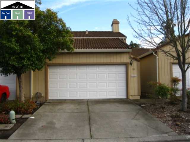 a front view of a house with a garage