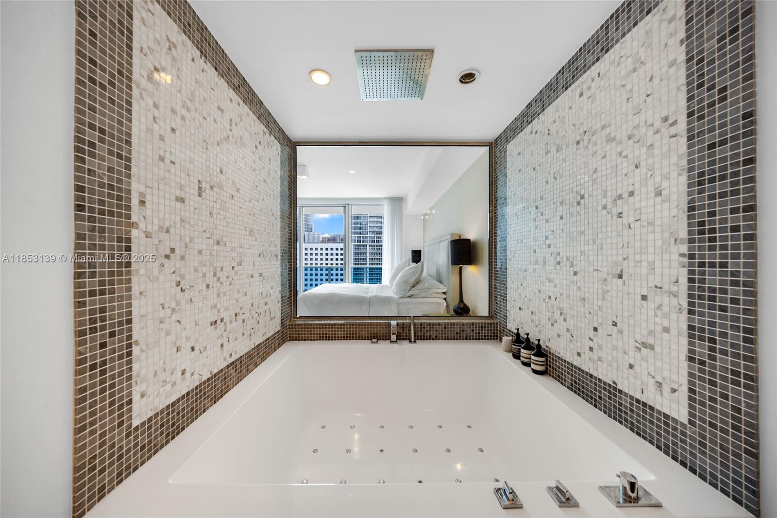 200 Biscayne Blvd Way, Unit 904 Miami, FL 33131 - Photo 16 of 24 a view of a hallway with wooden floor and a large window