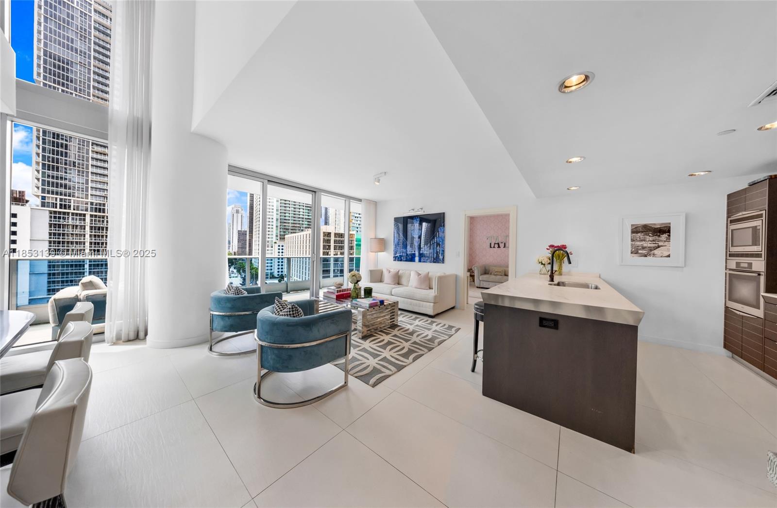 200 Biscayne Blvd Way, Unit 904 Miami, FL 33131 - Photo 4 of 24 a living room with furniture and a potted plant