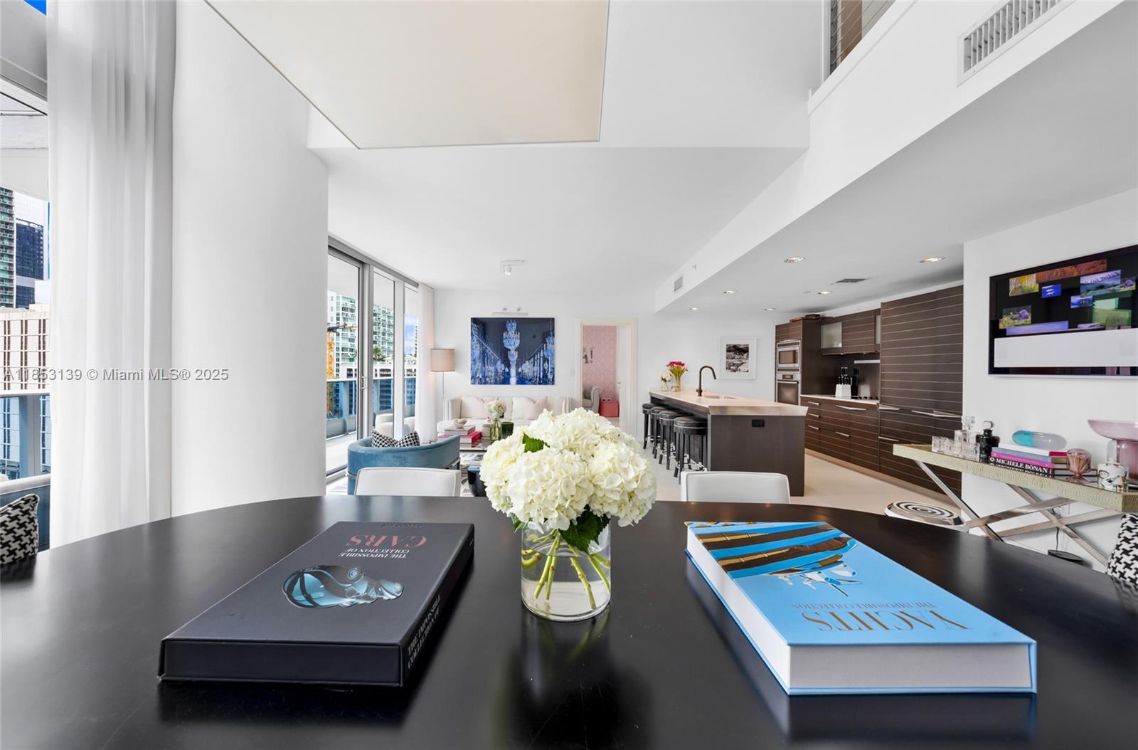 200 Biscayne Blvd Way, Unit 904 Miami, FL 33131 - Photo 6 of 24 a living room with furniture and next to a window